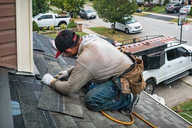 Professional Roofing technician working in Gower, MO